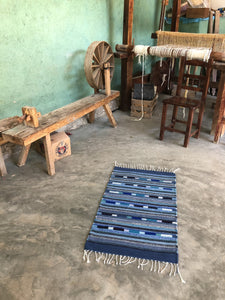 Handwoven blue natural wool rug from Oaxaca Mexico.