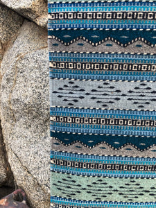 Area rug made by hand, natural dyes create blue, green gray and turquoise accents.