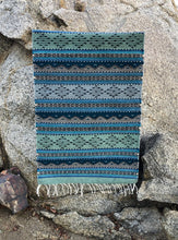 Load image into Gallery viewer, Handwoven Cortez natural wool rug, handmade in Mexico with blue, green, grey and turquoise details. 