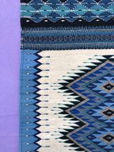 Load image into Gallery viewer, Handwoven Costa Wool Rug, area rug with blues, creams and black details.