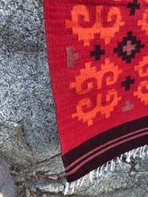 Load image into Gallery viewer, Natural sustainable dyes used to color the wool rug in red, orange, purple in a tribal pattern.