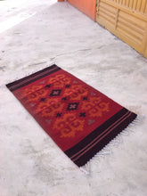 Load image into Gallery viewer, Natural dyes from plants and extracts used to color the handwoven rug.